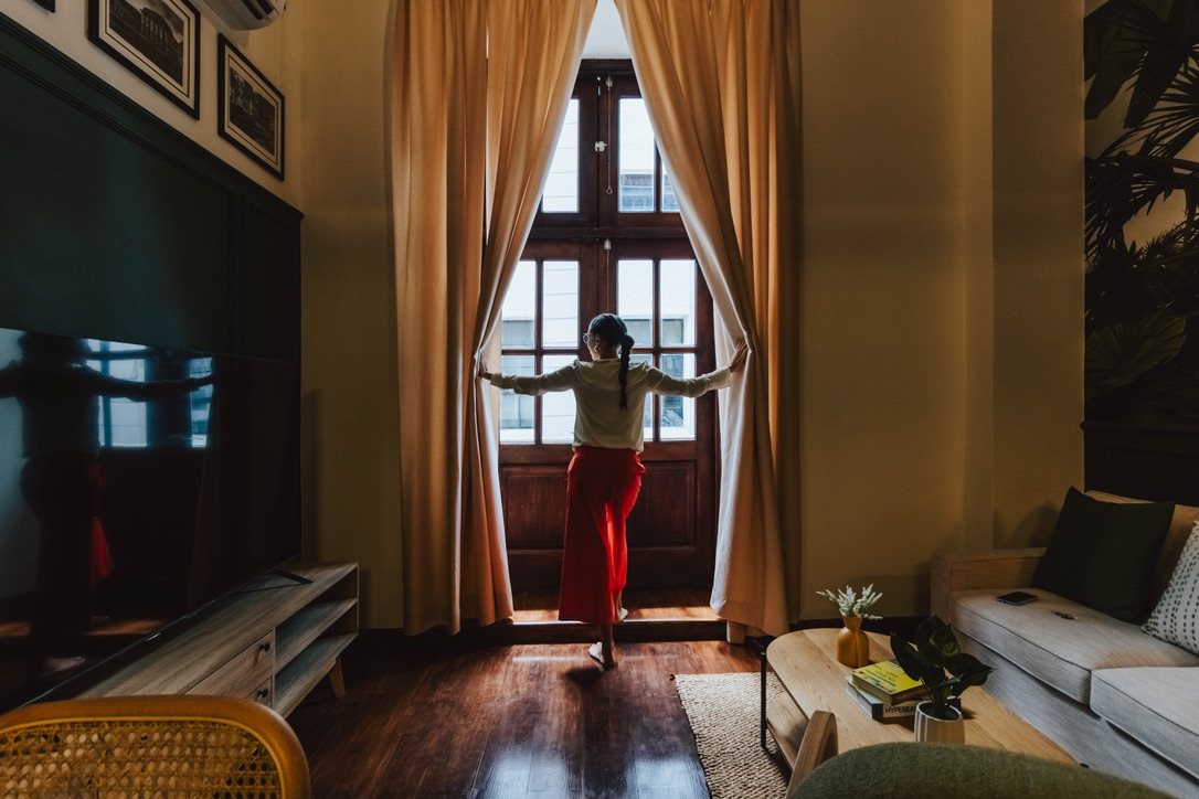 Tall colonial window overlooking Casco Viejo from Plaza Catedral Loft